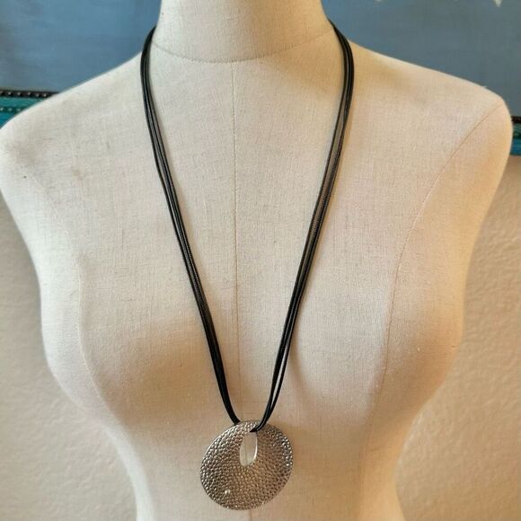 Round silver tone pendant necklace on long black cord - Picture 2 of 10
